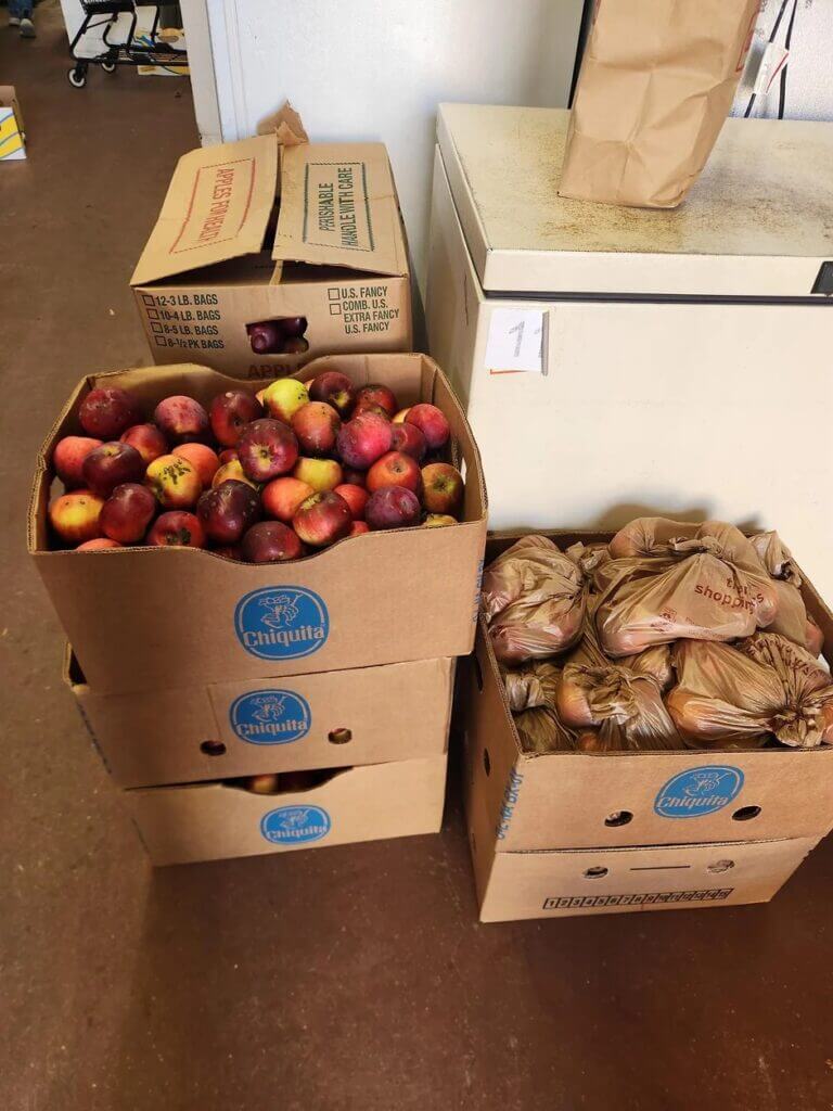 Fresh apples and other produce in boxes ready to serve to the Biddeford community